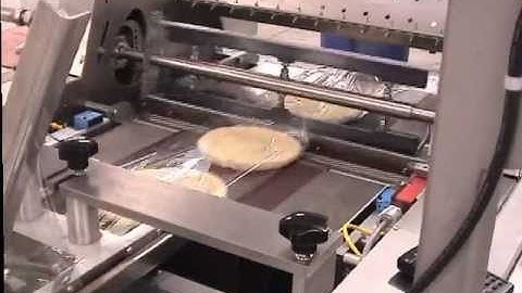 Conflex Evolution 200SS Lap seal shrinkwrapper running Pizza