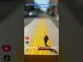 Miniature road crew painting yellow lines on the spine of an oversized textbook | Tiny World