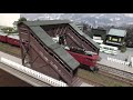 跨線橋のある昭和の町並みを走るED75と国鉄客車50形