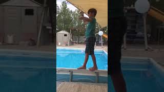 Kid Trying to Walk Over Pool's Edge Tumbles into Water and Throws a Fit - 1068039