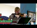 Michael Westerby, a high school violinist gives a Christmas concert at G.I. Public Library Monday