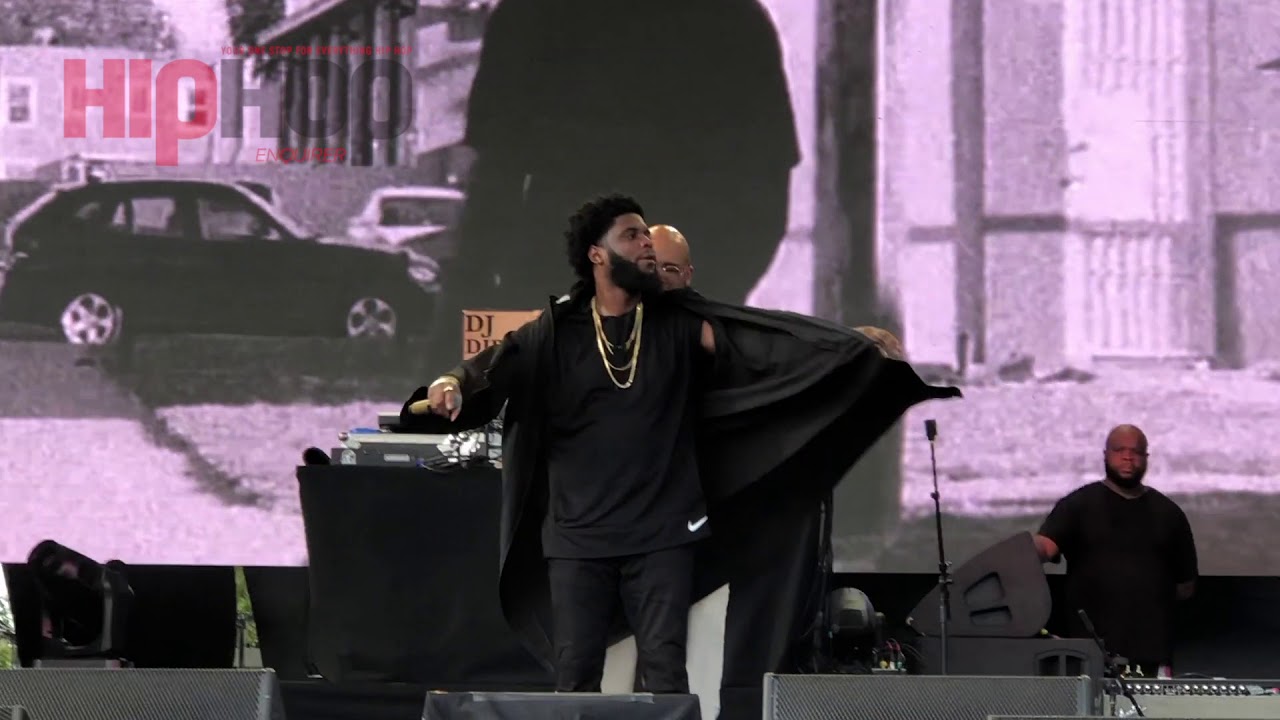 Big Krit performing on stage, surrounded by a crowd