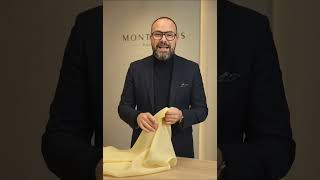 Video presentation of matte butter yellow organza being handled to show its soft touch, fluid drape and structured body