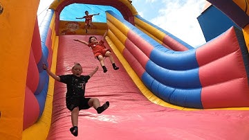 Crazy GIANT Inflatable SLIDE Fairground Ride - Hale Village Carnival