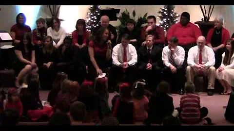 Christmas 2010 Kara Scurlock singing to children.....