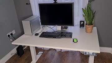 Standing desk cable management guide. Power strip.