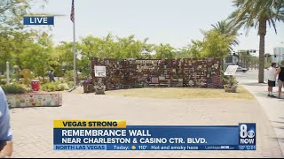 Volunteers move Healing Garden Remembrance Wall to grass field