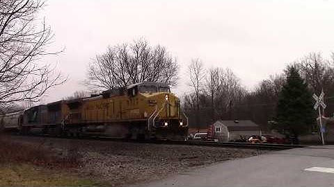 UP C44-9W leads a CSX SD70MAC On NS Grain Train
