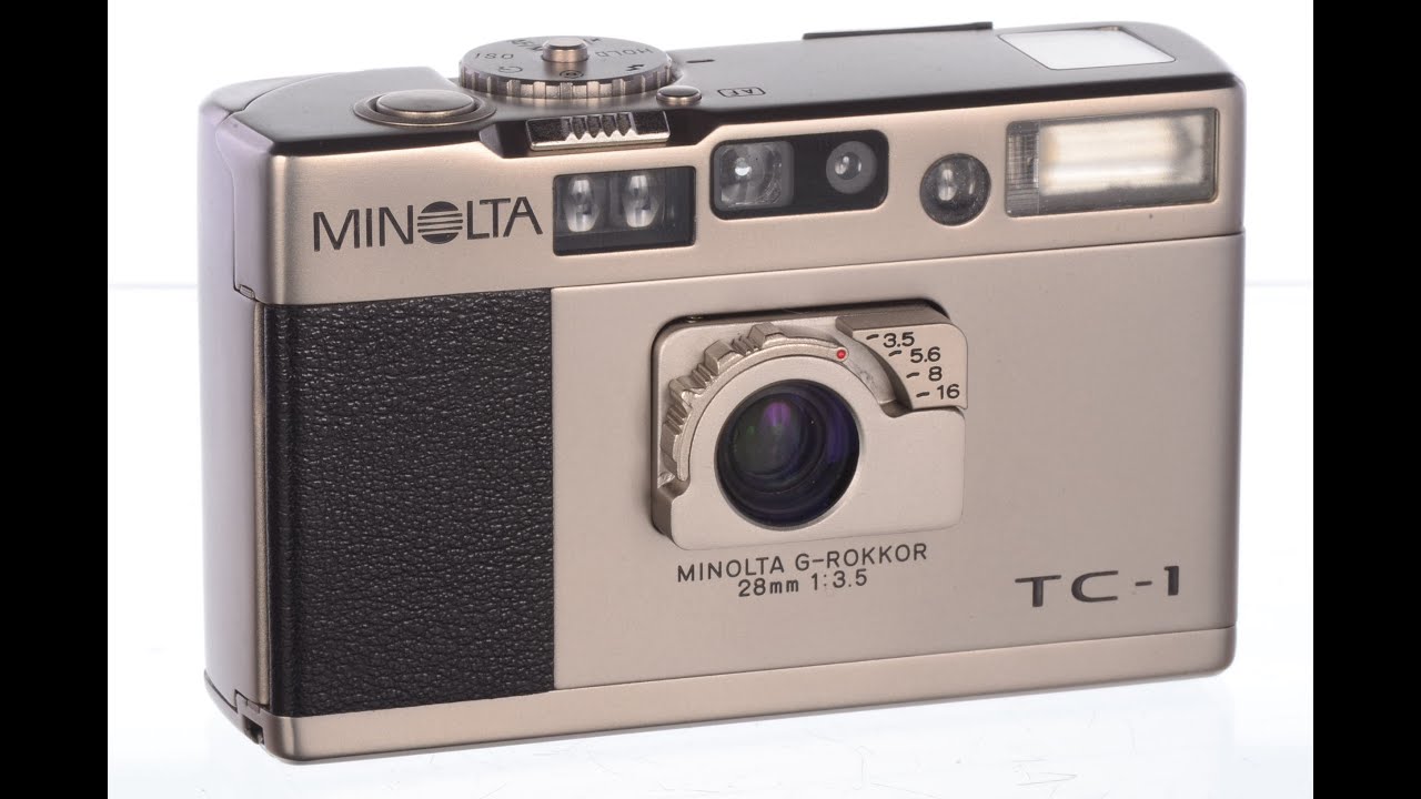 Minolta TC1 35mm camera overview with warning