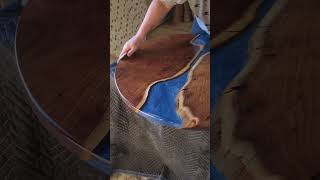 Finishing this Acacia live edge epoxy bar table I created for a client. #epoxyresin #naturalwood