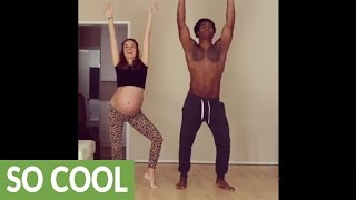 Pregnant couple dance with their baby