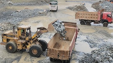 Caterpillar 966E Wheel Loader | Big Rock Loading on Dump Truck | Heavy Equipment Power