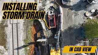 installing storm drain | in cab view