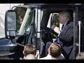 Donald trump takes a long drive in a parked truck