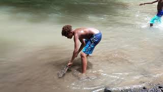 Costa Rica - Roman aka Tarzan playing in the river!