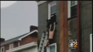 Suspect Dangles From Window After Trying To Escape From Deputies