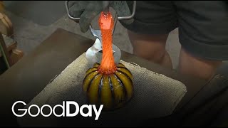 Molly is learning how to make handblown glass pumpkins!