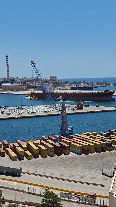 Navies Azure container Ship (IMO 9324851, MMSI 538007610) towed for docking at the Port of Piraeus