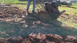 Simplicity walk behind tractor plowing