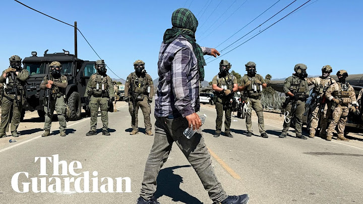 Protesters and US federal agents clash during immigration raid at California farm