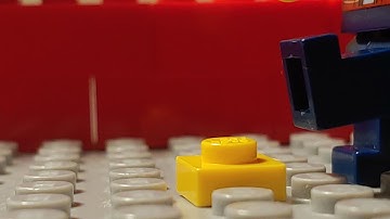 Lego man steps on LEGO brick