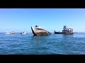 Ship and Tugboat sinking in ocean off of Daytona Beach