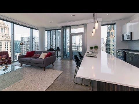 A skyline-view 1-bedroom model at the Loop's luxurious MILA apartments
