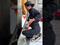 pressing a ceramic tile against the wall using suction tools for precise positioning firm adhesion