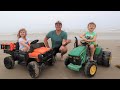 Using toy tractors to find hidden treasure on the beach | Tractors for kids