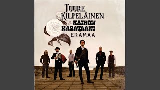 Video thumbnail of "Tuure Kilpeläinen ja Kaihon Karavaani - Yksinäisen miehen puku"