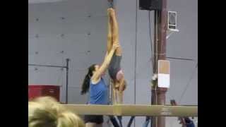 Sarah working a back extension roll for level 6 beam routine