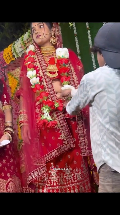 boy puts his finger inside woman's navel.