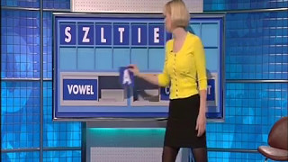 Young Rachel Riley - short skirt and black tights