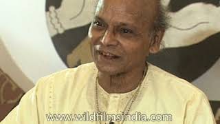 Kelucharan Mohapatra trains his woman dance students in Odissi dance, as he plays the Pakhawaj drum