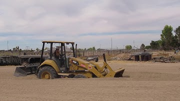 Week 6 –   CAT Skip Loader Grader Full Bucket