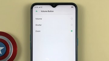 How to use the volume button to take pictures or zoom in the camera on OPPO A31 Android 9