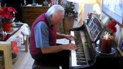 Jack Tourville plays  the piano at  the Dopps condo