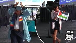 Anti-Israel Columbia grads wear zip ties, rip diplomas on stage during commencement