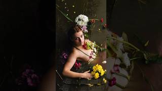 The Results Of Taking Photos Is A Muddy Lake With Flowers