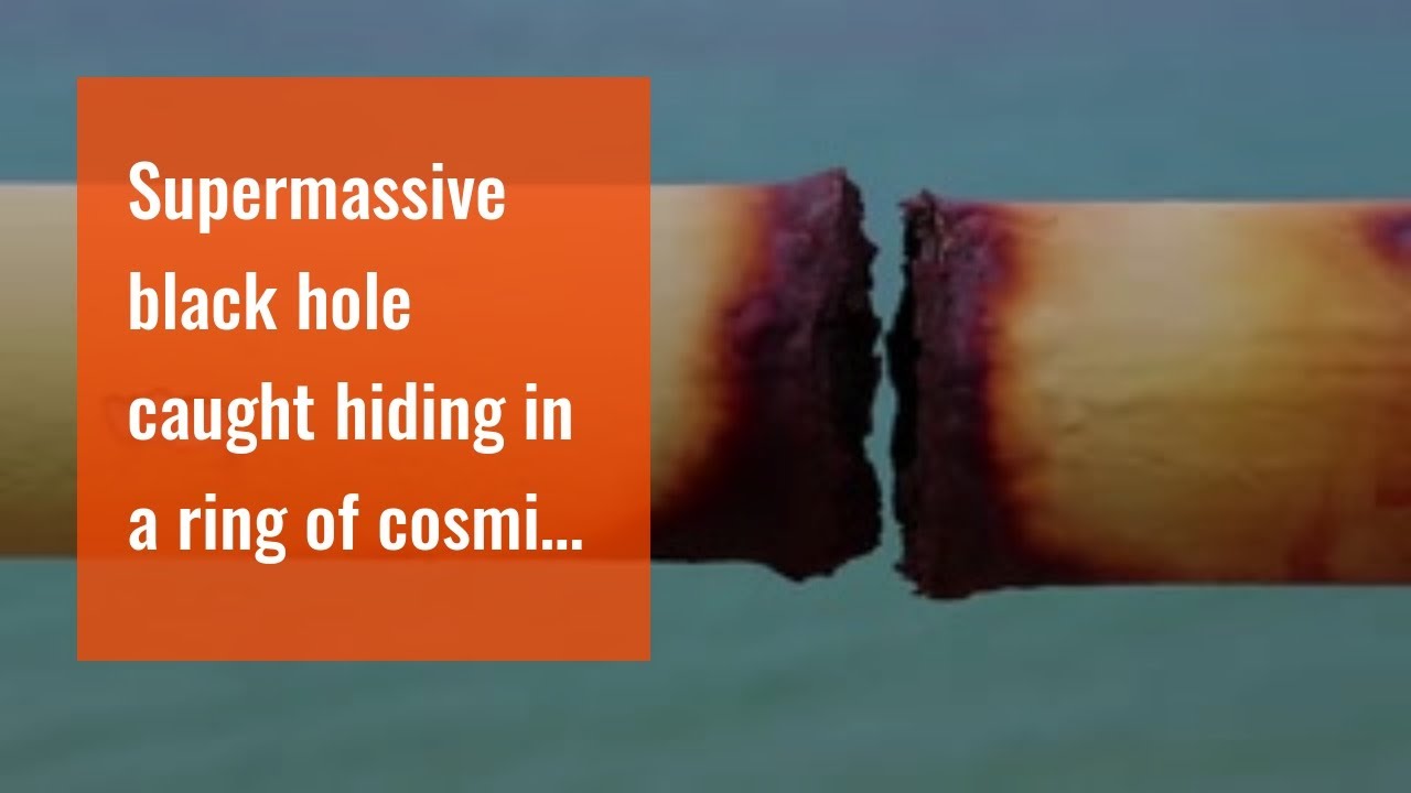 Supermassive black hole caught hiding in a ring of cosmic dust - YouTube