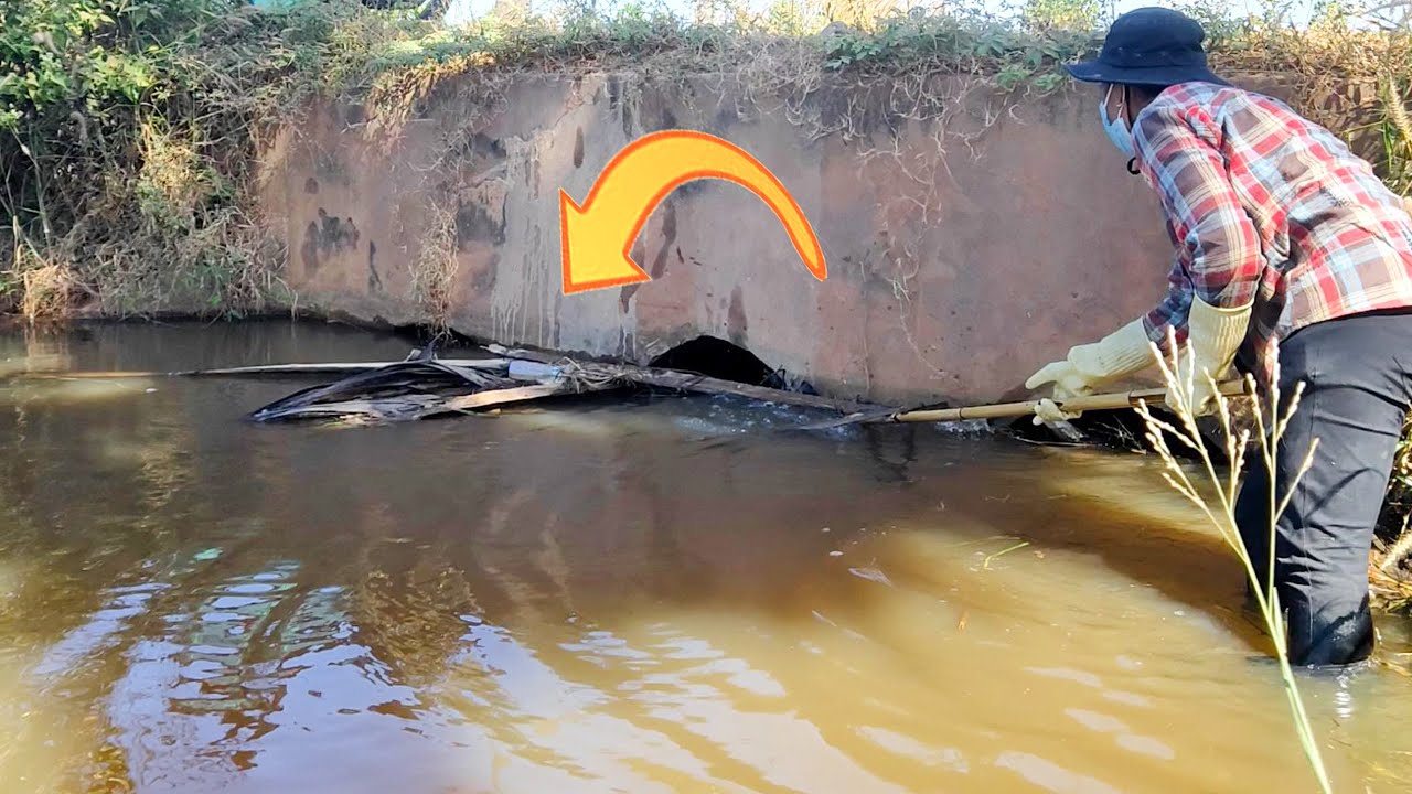 Unclogging 3 Culverts With Much Debris Stuck In Drains - YouTube