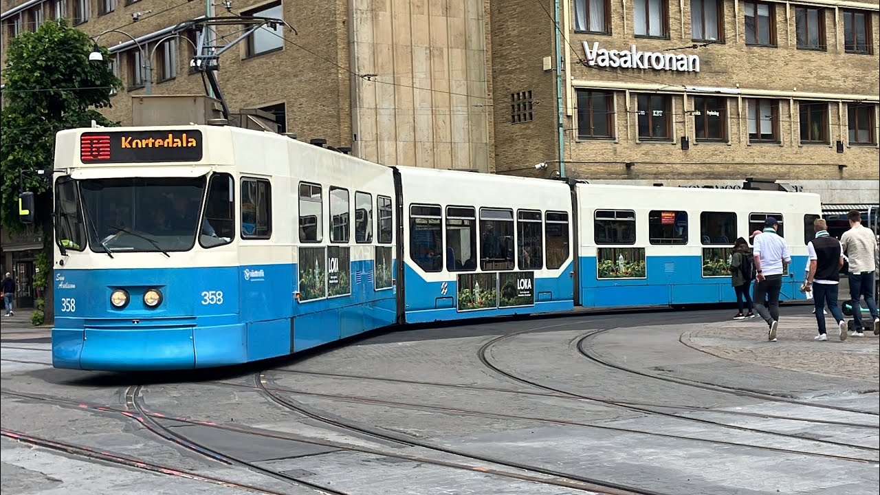 Spårvagnar och bussar i ett blåsigt centrala Göteborg, 7 juli 2024