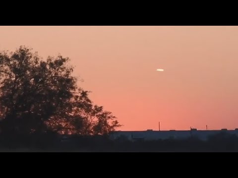 White Cigar-Shaped Object Filmed Hovering Over Fort Worth Area