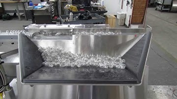 Performance Feeders step feeder orients and feeds automotive light bulbs