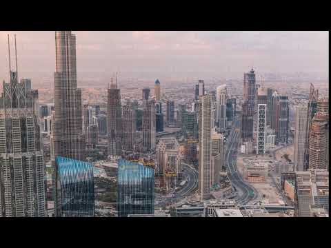 Dubai Downtown skyline futuristic cityscape with many skyscrapers and Burj Khalifa aerial timelapse.