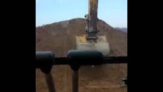 345B CAT LOADING TRI-AXEL DUMP TRUCK