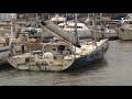 Lancien bateau de christophe auguin vainqueur du vendeglobe abandonn dans le port de cherbourg