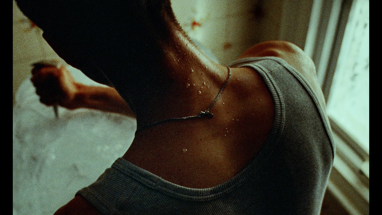 A Frog Sits In Water (Short Film)