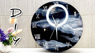 Epoxy resin clock 30 cm. Black with silver. Resin Art.