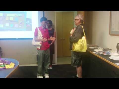 Team members craft a superhero cape that functions as a wearable coloring book that is used as a tool to share vulnerabilities.